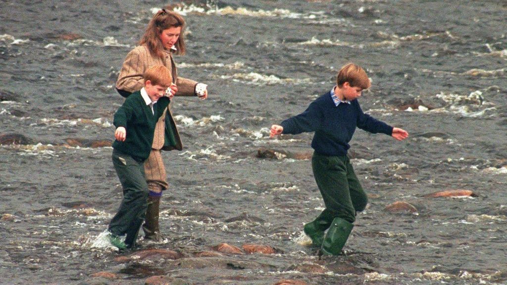 Royal Nanny, Tiggy Legge-Bourke, Prince William,and Prince Harry walk in the River Gairn, near the Balmoral Estate on in October 1994