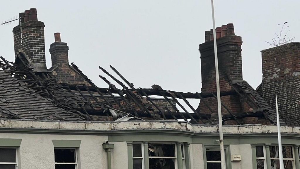 Fire-damaged roof of The Leopard pub