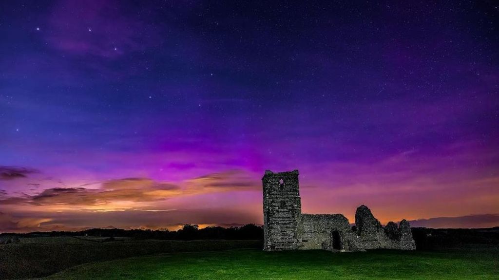 The northern lights above Knowlton Church, Dorset