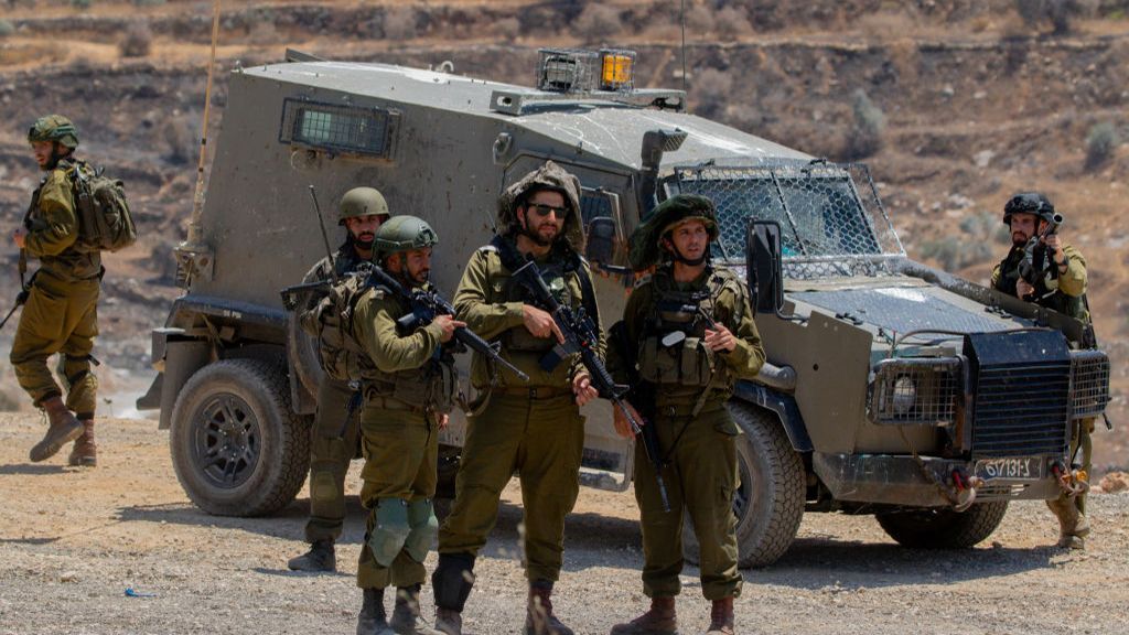 Israeli troops gather near Beita in West Bank where there were weekly protests against Israeli settlement of Evyatar