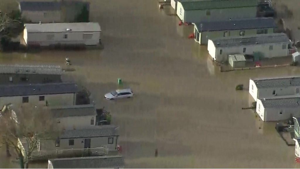 Submerged mobile homes and a car