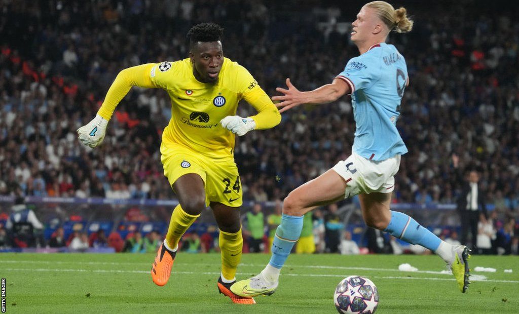 Andre Onana (left) takes the ball past Erling Haaland during the 2022-23 Champions League final