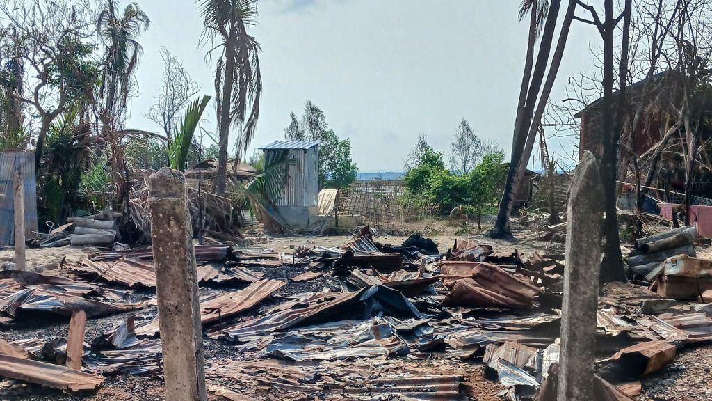 This photo taken on May 21, 2024 shows a destroyed house and burned trees following fighting between Myanmar's military and the Arakan Army (AA) ethnic minority armed group in a village in Minbya Township in western Rakhine State