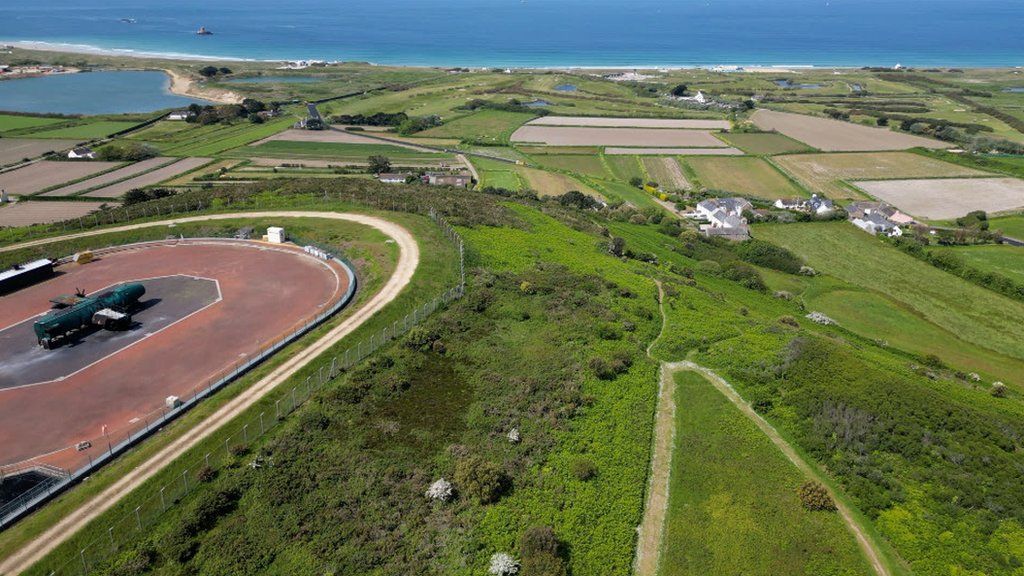 Jersey Airport training ground, nearby properties and coastline