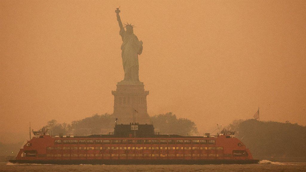 The Statue of Liberty shrouded by haze and smoke caused by wildfires in Canada