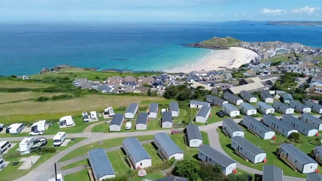 View over holiday park to coastline of Cornwall and Porthmeor Beach