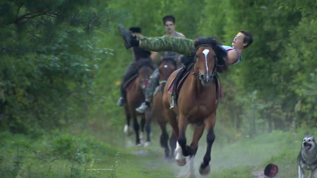 Cossack horsemen riding Russia's growing patriotism - BBC News