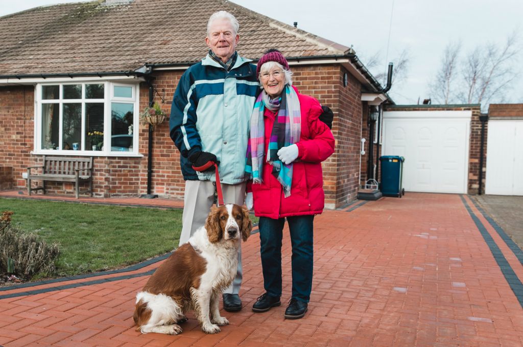 Elderly couple with their dog