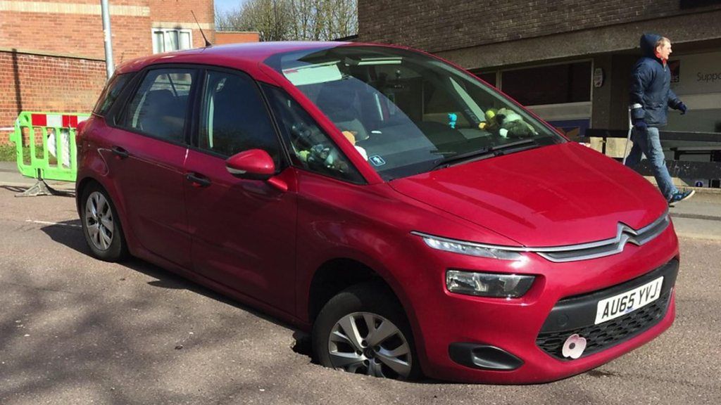 Car stuck in Norwich sinkhole