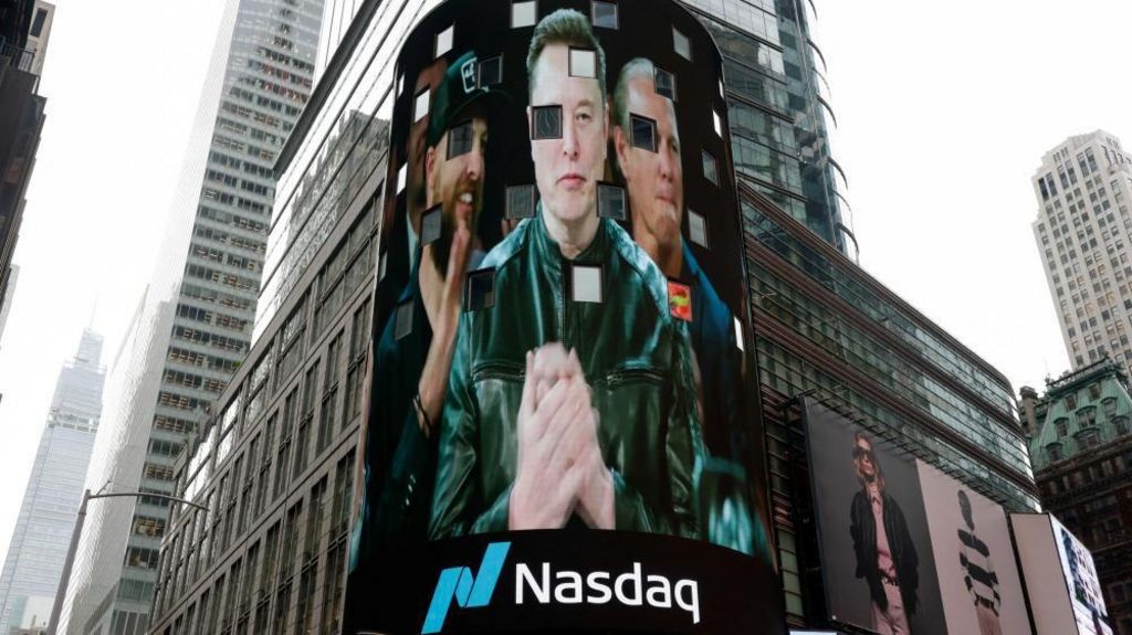 Elon Musk appears on a large curved billboard in New York with the Nasdaq logo as his SpaceX company goes public.