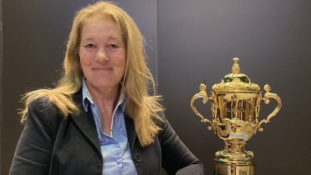 Claire Donovan, pictured next to the World Cup trophy