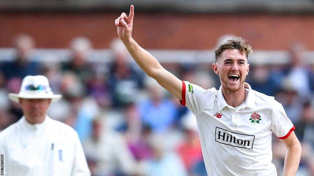 George Balderson celebrates taking a wicket for Lancashire