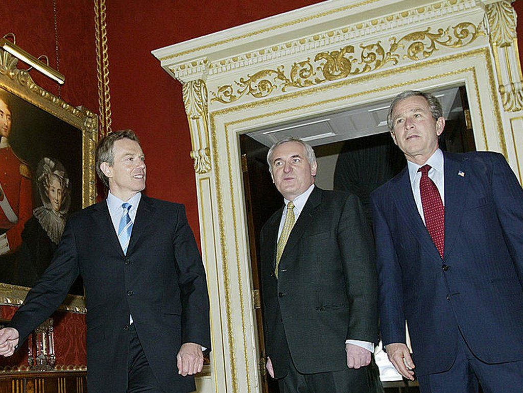 US President George W. Bush (R), British Prime Minister Tony Blair (L), and Prime Minister of Ireland Bertie Ahern walk into a lunch meeting 08 April 2003 at Hillsborough Castle in Hillsborough.