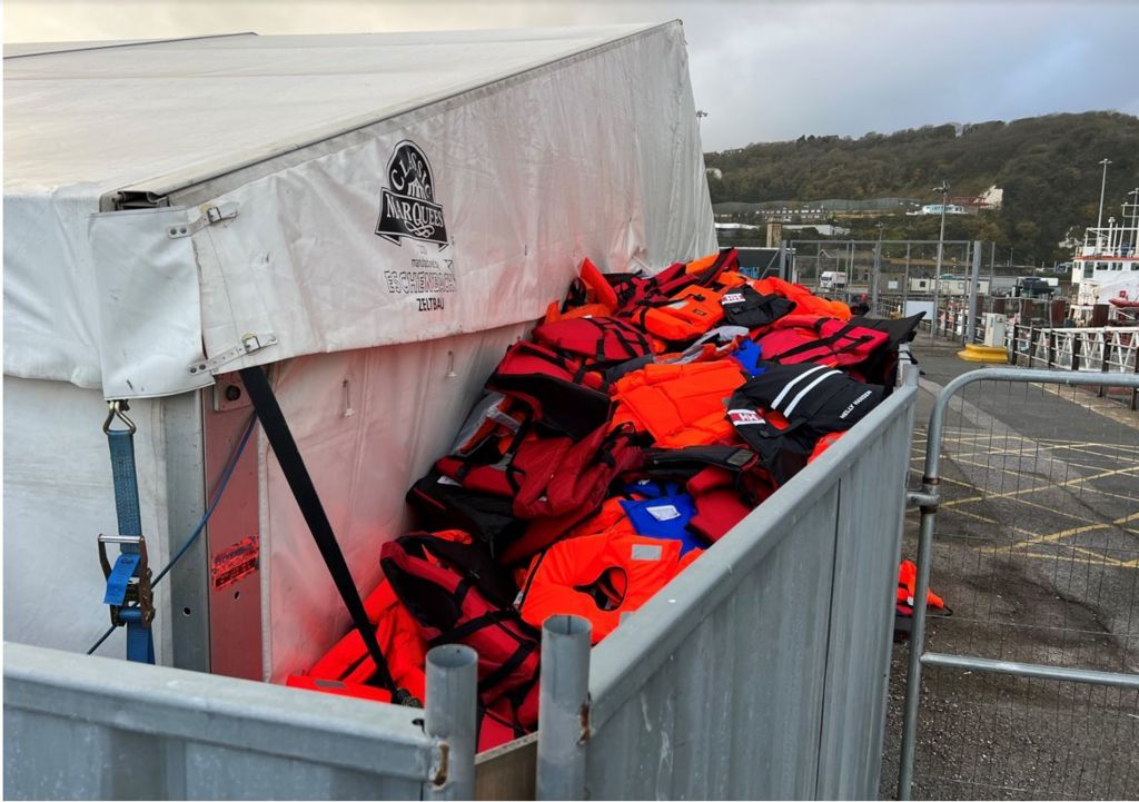 Exterior of marquee with pile of life jackets
