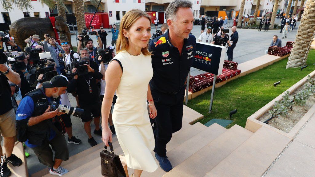 Christian Horner and wife Geri surrounded by photographers