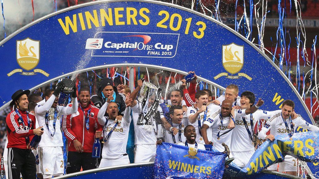 Swansea's players celebrate with the Capital One Cup