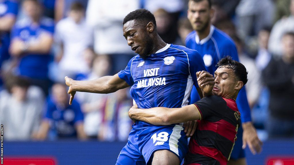 Ebou Adams (left) is tackled by Andre Dozzell of QPR