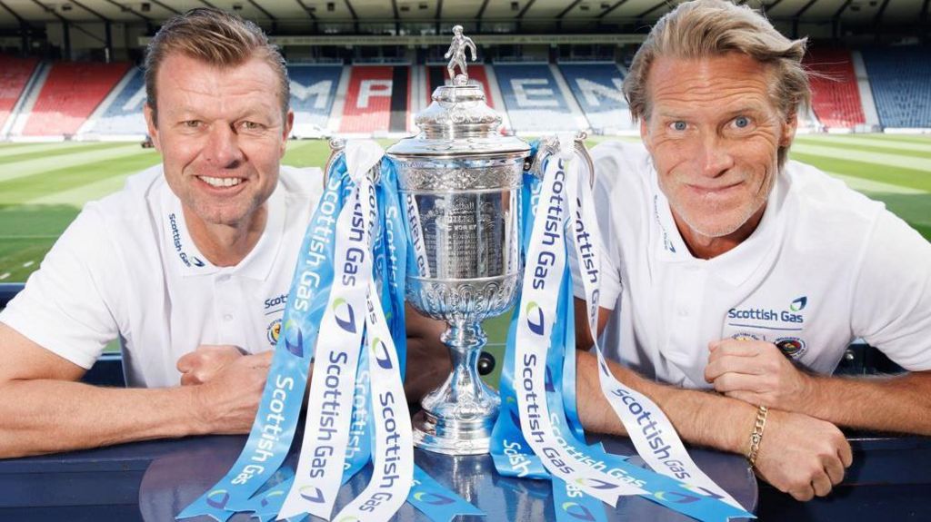 Former Old Firm rivals Arthur Numan and Johan Mjallby pose with the Scottish Cup