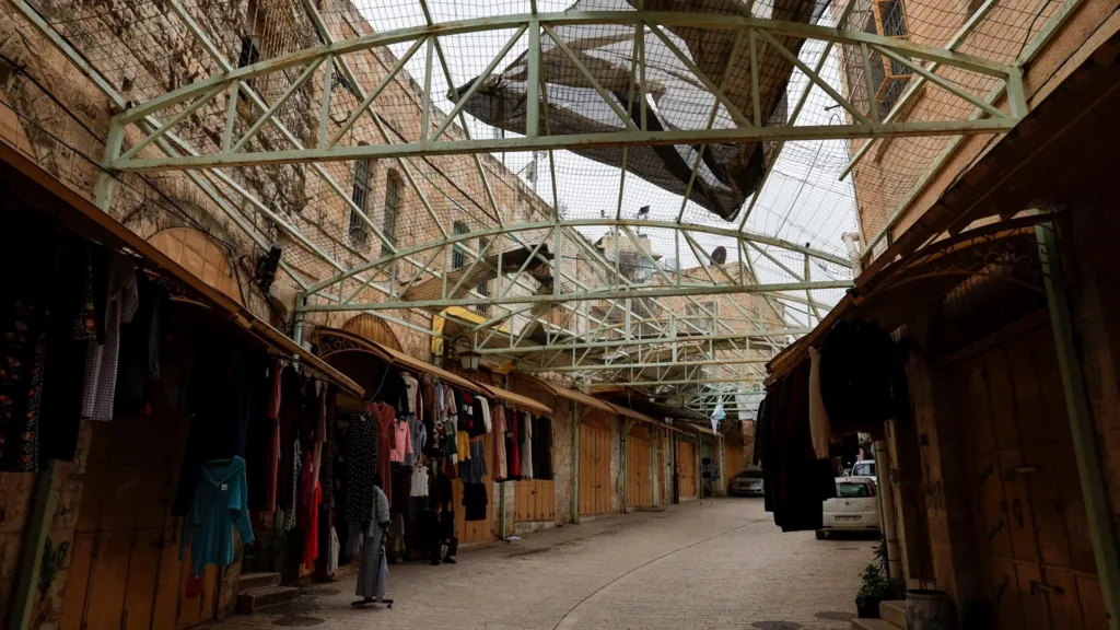 Wire fencing above a street in the old city of Hebron, in the occupied West Bank (9 February 2026)