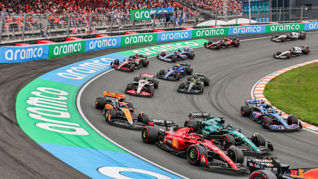 F1 cars travel through Turn Three at the Dutch Grand Prix at Zandvoort 