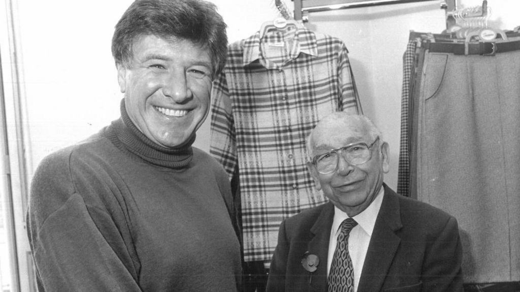 Former Liverpool and England footballer Emlyn Hughes pictured with Isaak Donner, founder of the Double Two clothing company in Wakefield