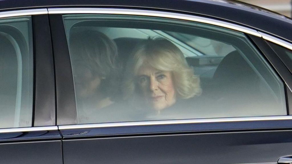 Queen Camilla pictured looking out of a moving car