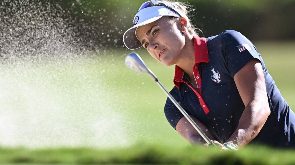 Lexi Thompson hitting a ball out of a bunker during the 2023 Solheim Cup