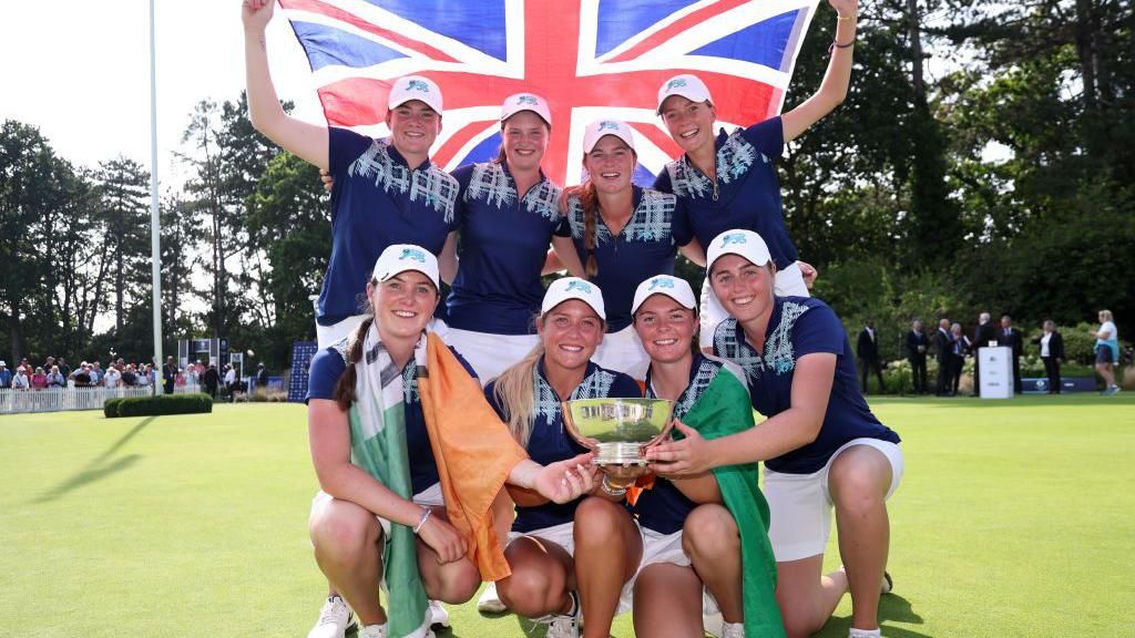 The victorious GB&I team celebrate with the Curtis Cup