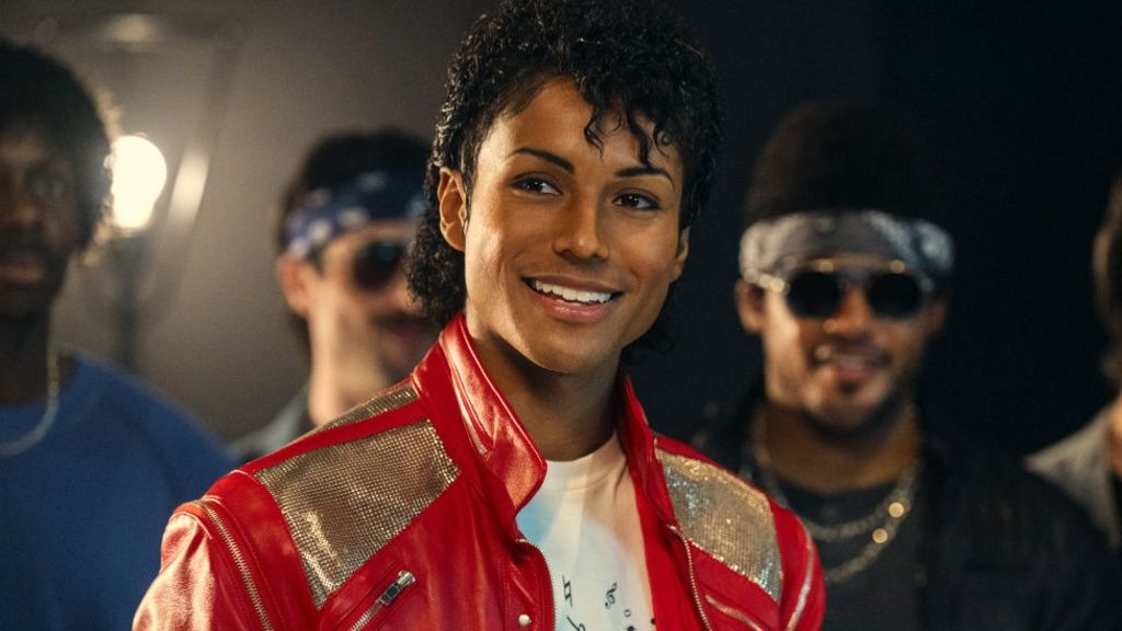 Jaafar Jackson as Michael Jackson in the musical biopic Michael, wearing a red and silver jacket