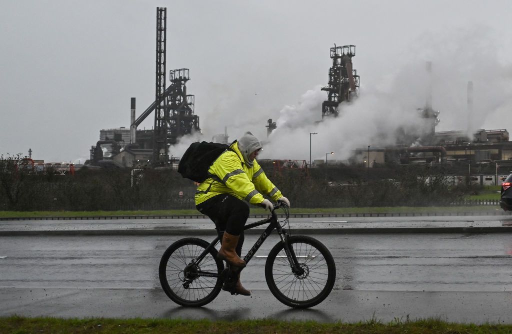 A workman cycles out of the Tata Steel Port Talbot steelworks