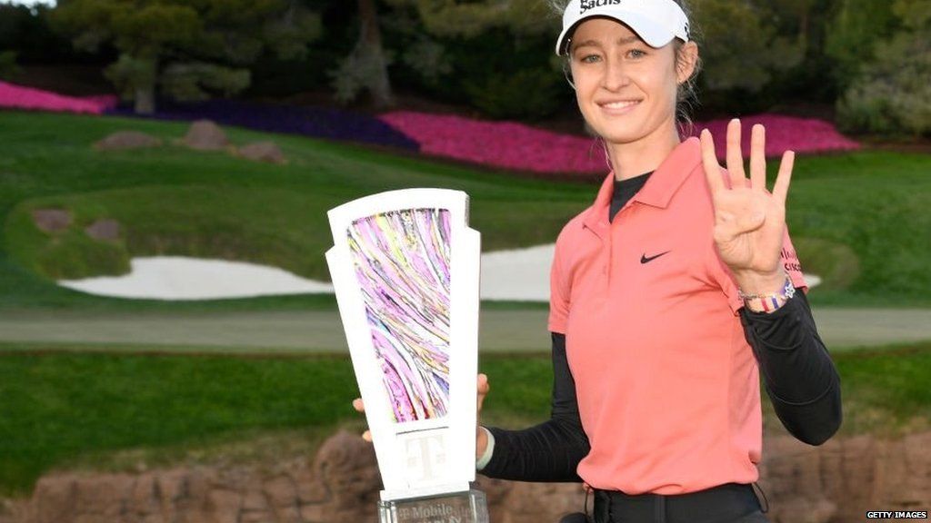 Nell Korda holds up four fingers to indicate her number of consecutive wins after claiming the Match Play title