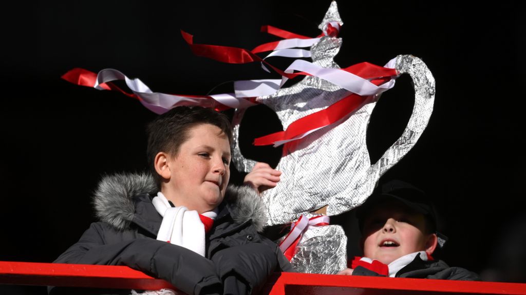 Football fans with a tin foil FA Cup