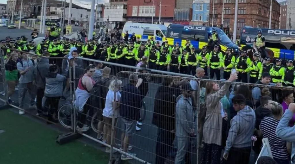 Police officers try to control crowds