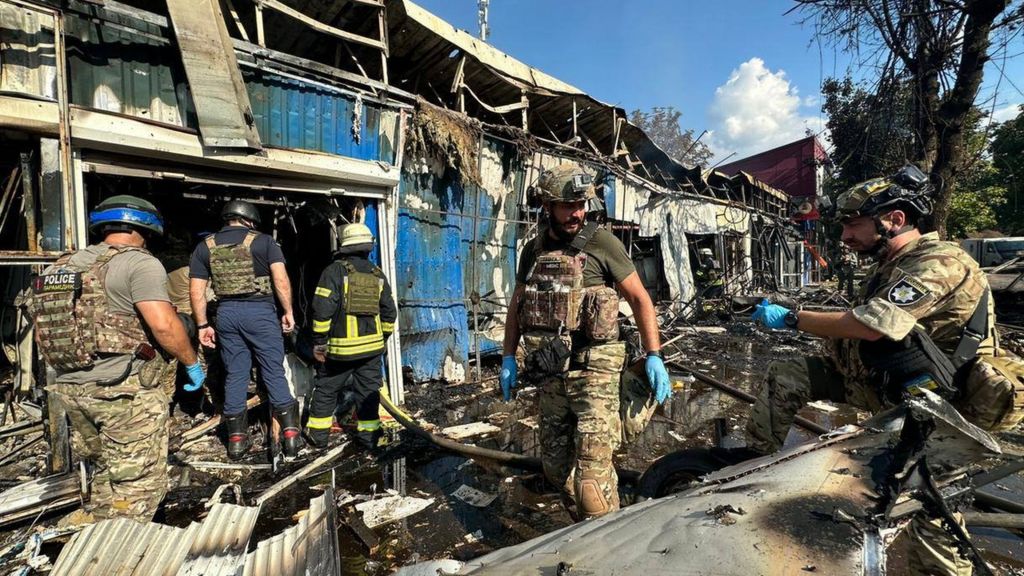 Rescue workers sift through the rubble