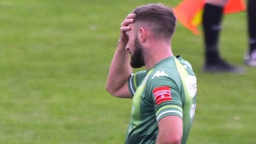 A dejected Guernsey FC player