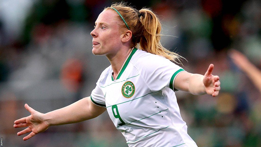Amber Barrett celebrates scoring against Zambia