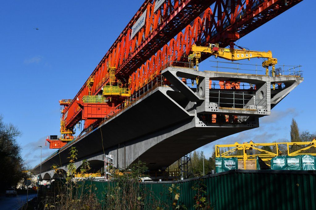 A 700 ton bridge building machine known as a 'launch girder', drops a pre-cast concrete section into place during construction of the HS2 Colne Valley Viaduct