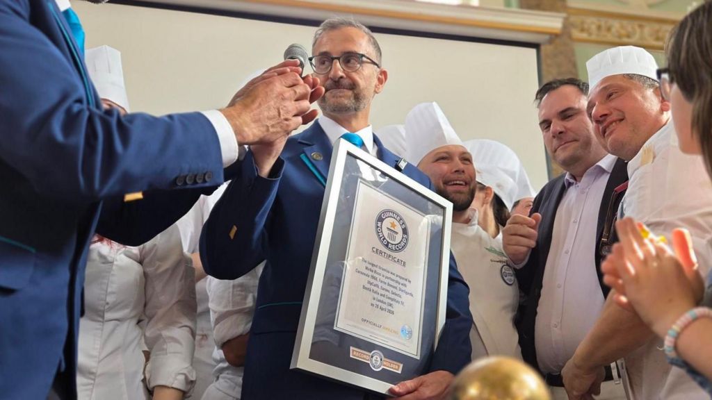 One of the Guinness World Record judges surrounded by chefs.