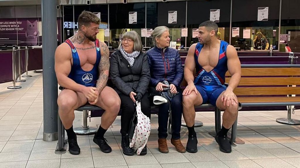 Gladiators Giant and Steel help passengers at Sheffield station BBC News