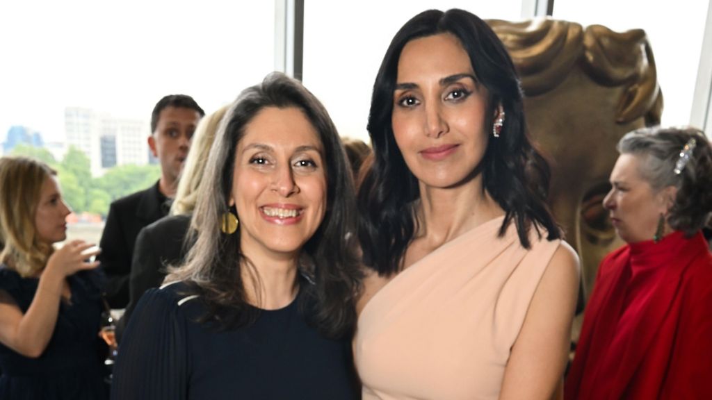Nazanin Zaghari-Ratcliffe posing and smiling with Narges Rashidi