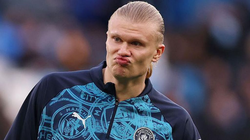 Erling Haaland of Manchester City reacting in a warm up. He is pursing his lips and his forehead his raised.