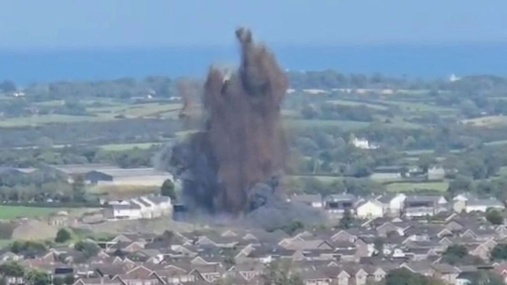 Explosion in Newtownards, County Down, large black flume above housing estate