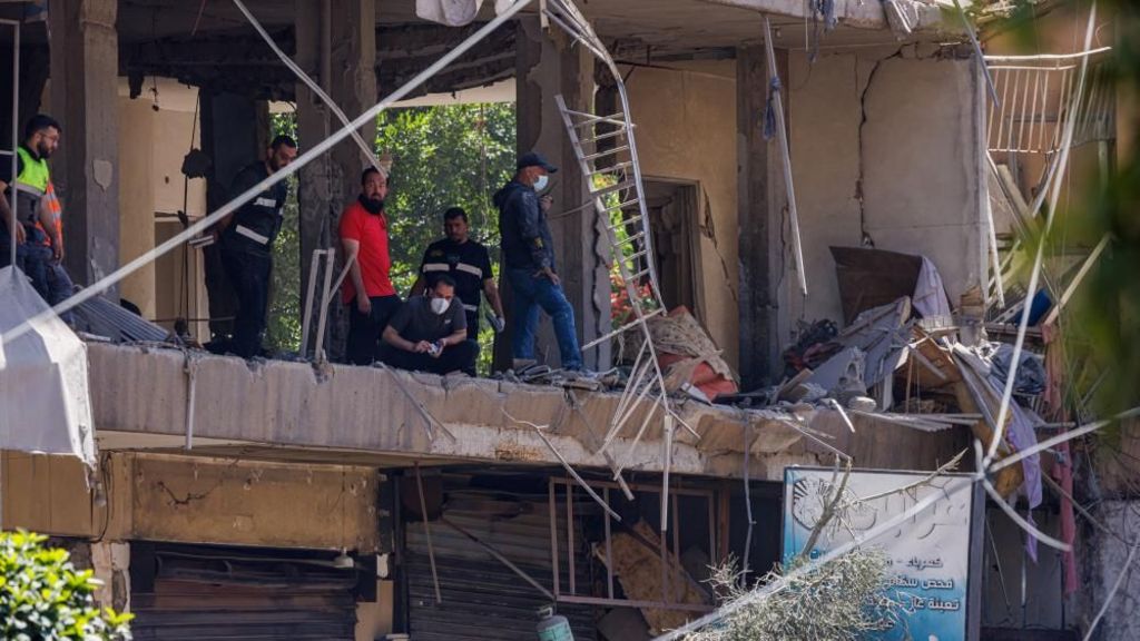 Police officers and emergency personnel work at the site of an Israeli strike on Beirut's southern suburb of Dahieh, Lebanon. Photo: 14 June 2026