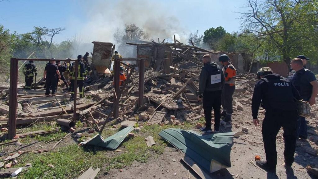 A woman died when two homes in Kharkiv were hit in a Russian attack on Friday