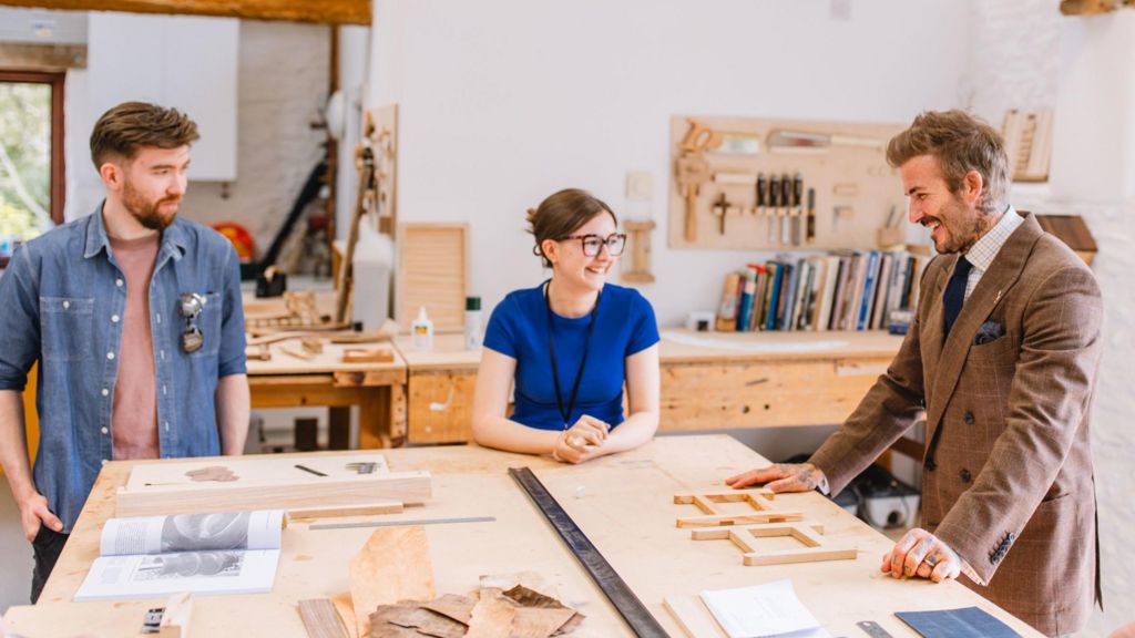 Handout photo issued by The King's Foundation of David Beckham, who is today announced as a new ambassador for the King's charity The King's Foundation, visiting students at the Snowdon School of Furniture, part of The King's Foundation's education offering based at Highgrove.