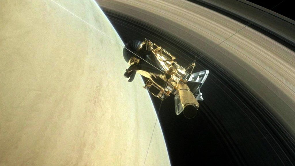 Artwork of the Cassini probe in front of Saturn
