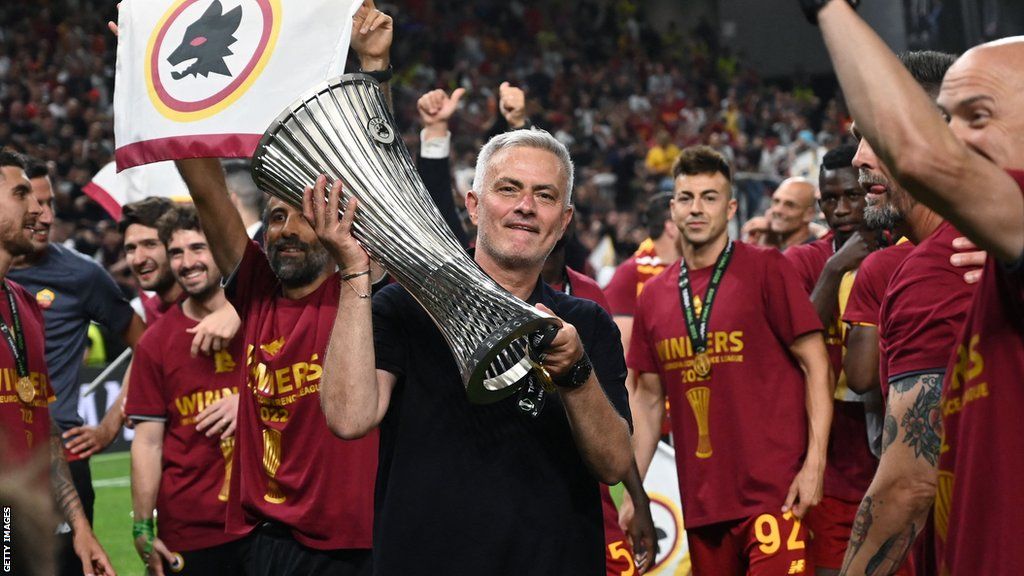 Jose Mourinho holds the Europa Conference League trophy