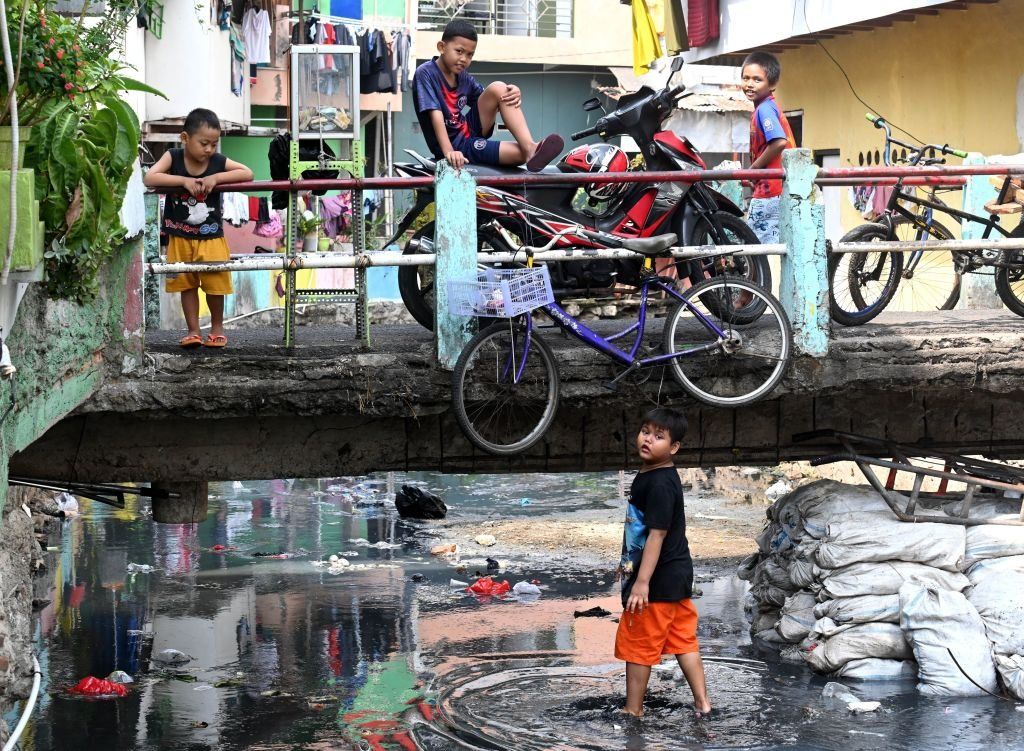 Children in kampungs, overly populated neighbourhoods.