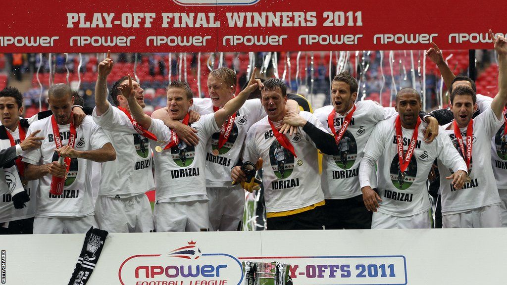 Angel Rangel (right) celebrates with his team-mates after Swansea beat Reading in the 2011 Championship play-off final to become the first Welsh club to reach the Premier League
