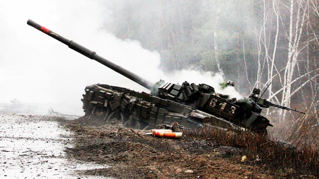 Smoke rises from a destroyed Russian tank in Ukraine, 26 February